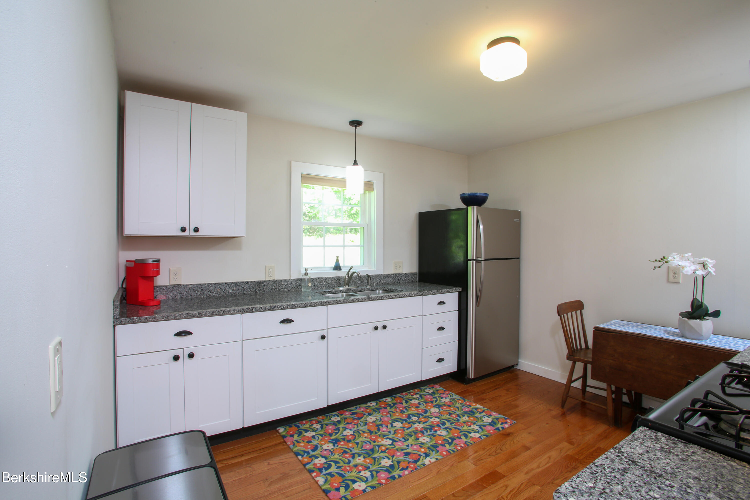 127 County Road Rowe, MA 01367 - Photo 11 of 29 a room with cabinets and window