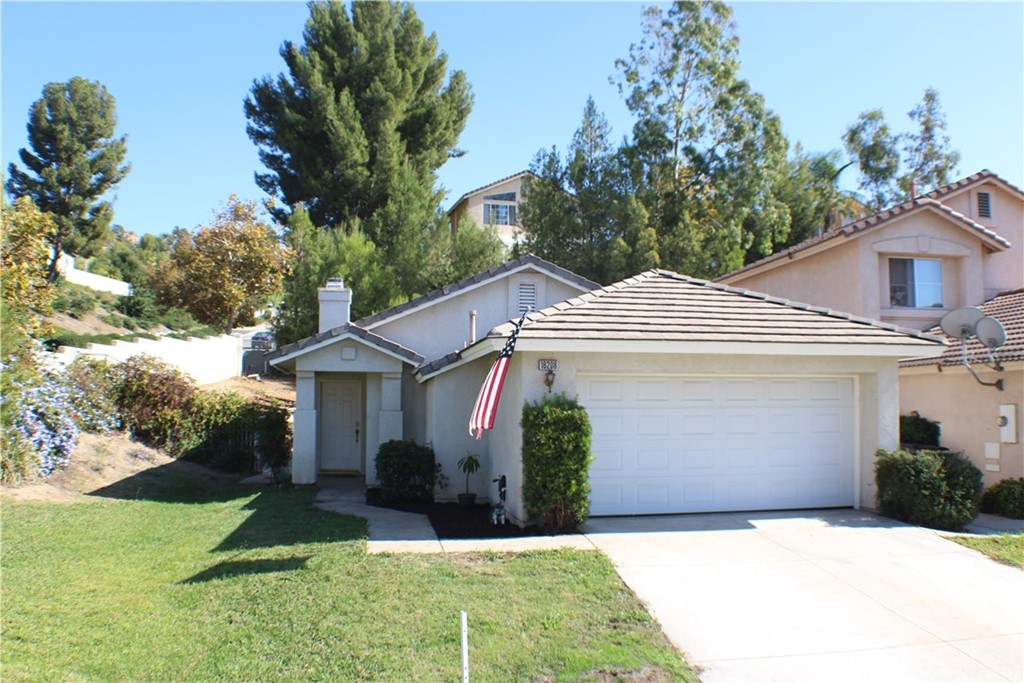 16208 Twilight Circle Riverside, CA 92503 - Photo 1 of 1 a front view of a house with garden