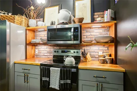 a kitchen with a faucet a sink and a stove