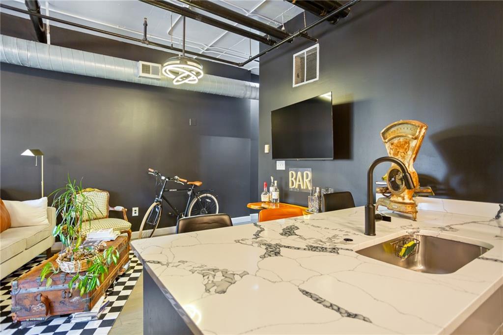 120 Ralph McGill Boulevard Northeast, Unit 405 Atlanta, GA 30308 - Photo 12 of 32 a kitchen with a faucet a sink and a stove