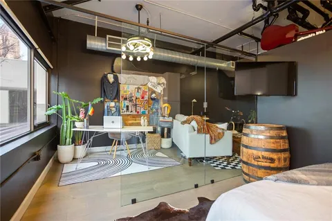 a bathroom with a toilet sink and shower