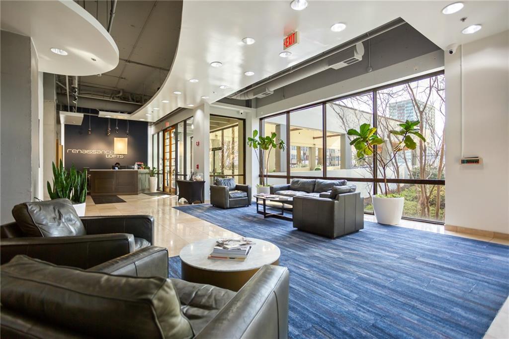 120 Ralph McGill Boulevard Northeast, Unit 405 Atlanta, GA 30308 - Photo 25 of 32 a living room with furniture and a large window