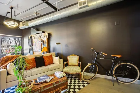 a dining room with furniture and chandelier