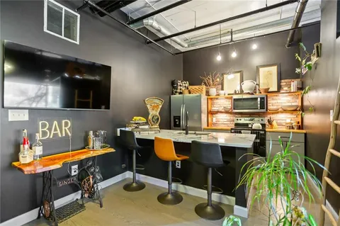 a kitchen with cabinets and appliances