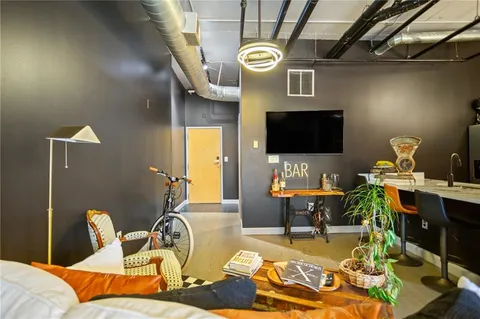 a kitchen with stainless steel appliances a stove and a microwave
