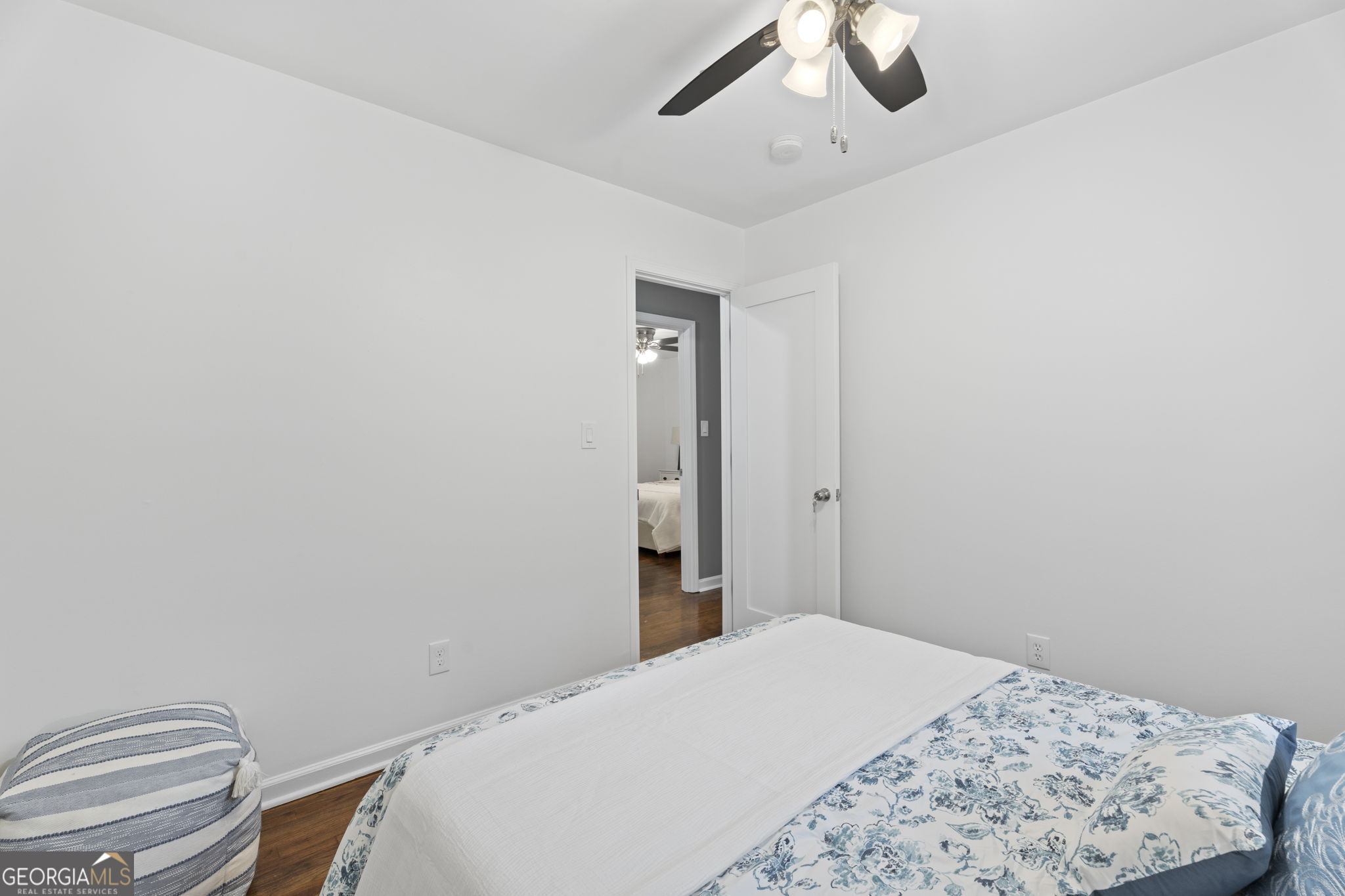 3567 Forrest Park Road Southeast Atlanta, GA 30354 - Photo 16 of 29 a bedroom with a bed and a chandelier