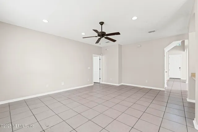 a view of a kitchen with a sink and a refrigerator a microwave