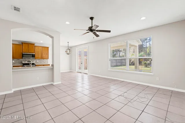 a kitchen with stainless steel appliances a refrigerator and a stove