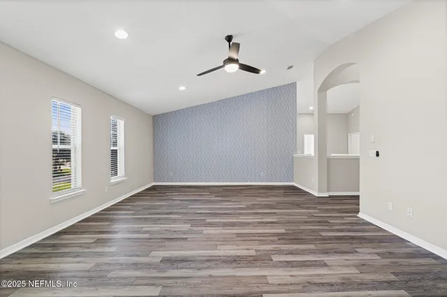 a view of a backyard with large trees