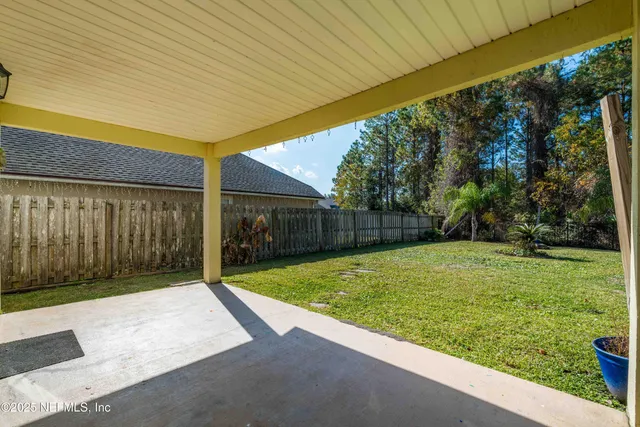 a house view with swimming pool in front of it