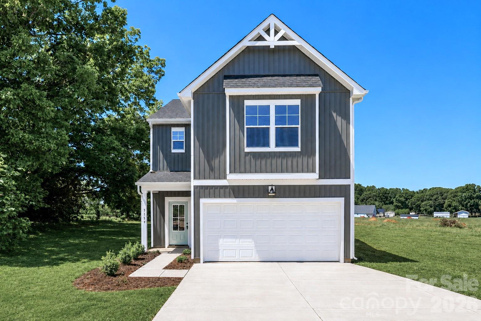 237 3rd Creek Road Stony Point, NC 28678 - Photo 2 of 29 a front view of a house with a yard