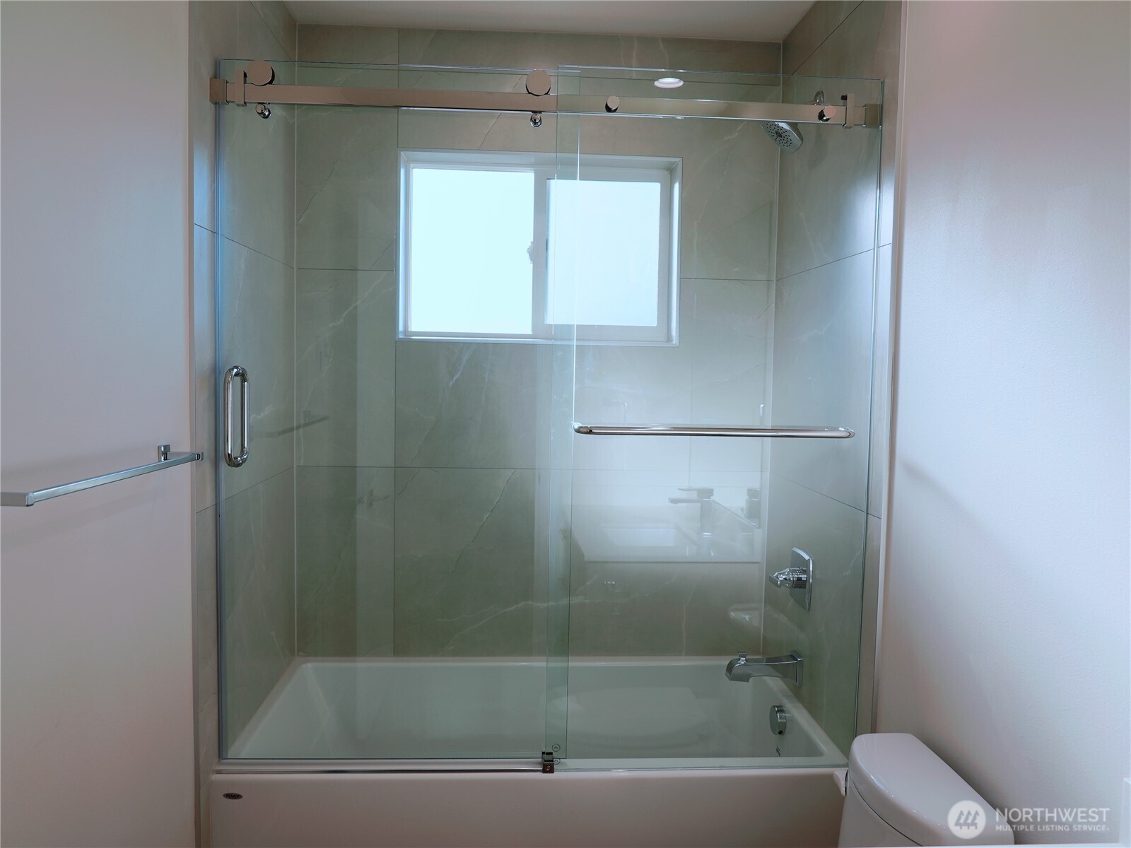 2155 Siddle Loop, Unit 106 Ferndale, WA 98248 - Photo 10 of 12 a bathroom with a shower a toilet and sink