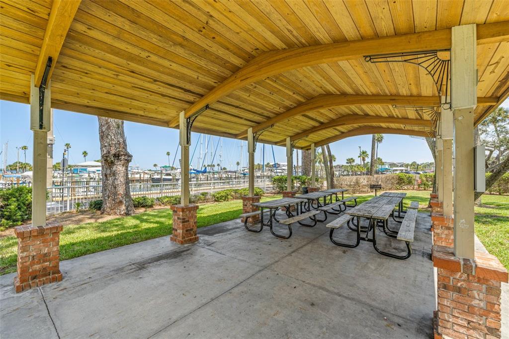 1370 Heather Ridge Boulevard, Unit 105 Dunedin, FL 34698 - Photo 45 of 56 a view of swimming pool with outdoor seating