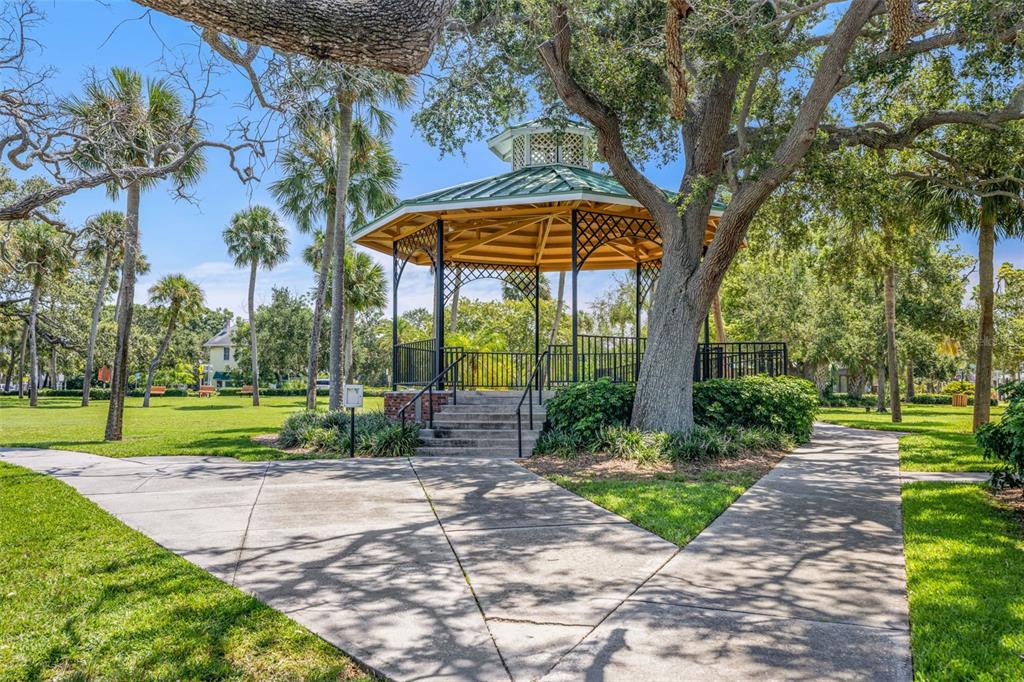 1370 Heather Ridge Boulevard, Unit 105 Dunedin, FL 34698 - Photo 46 of 56 a view of a park with a tree