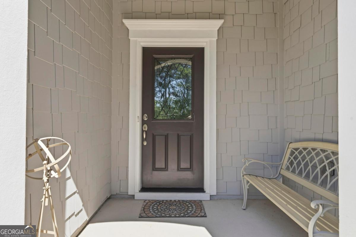1101 Little Shls Road Greensboro, GA 30642 - Photo 2 of 42 a bedroom with a chair and a window