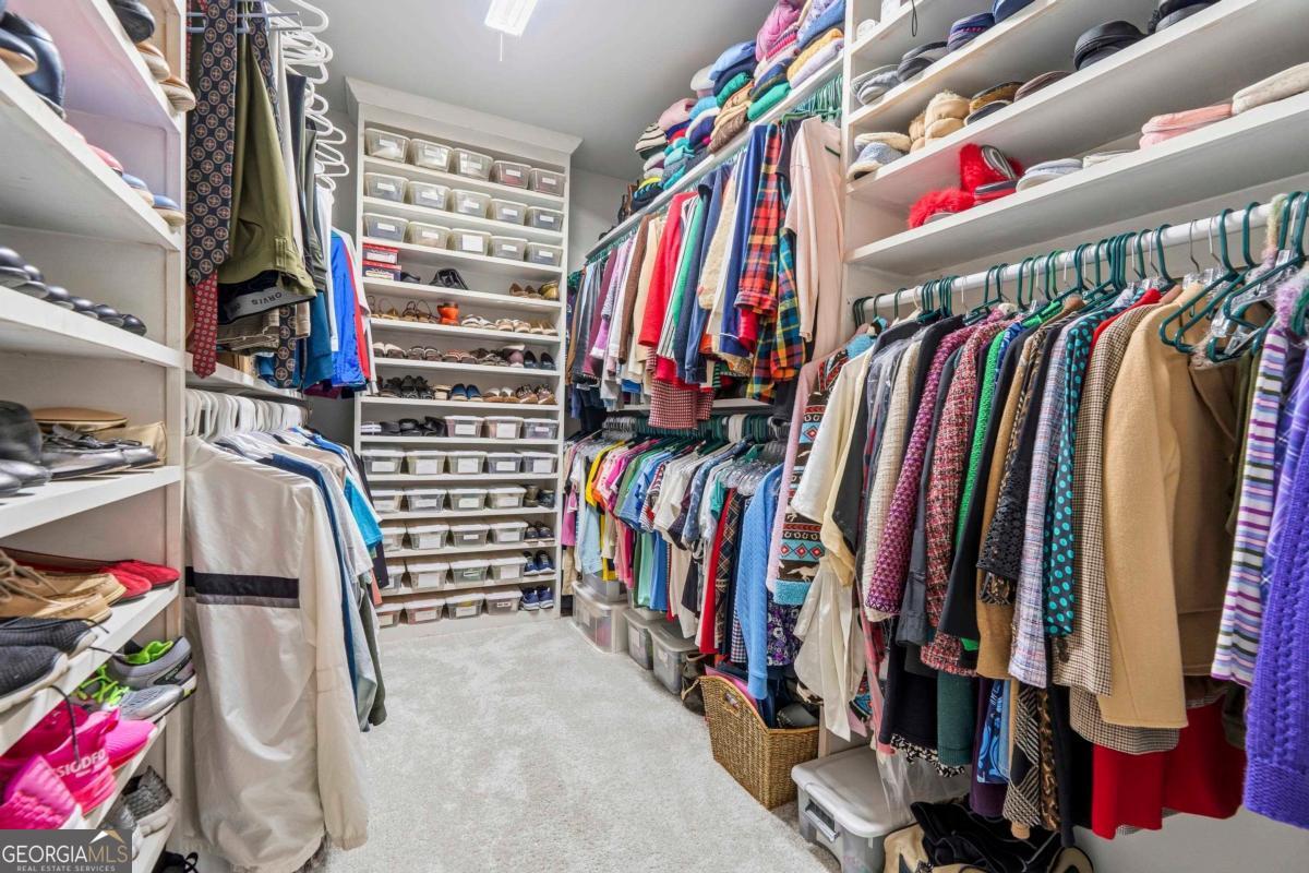 1101 Little Shls Road Greensboro, GA 30642 - Photo 25 of 42 a view of walk in closet with clothes and shoes