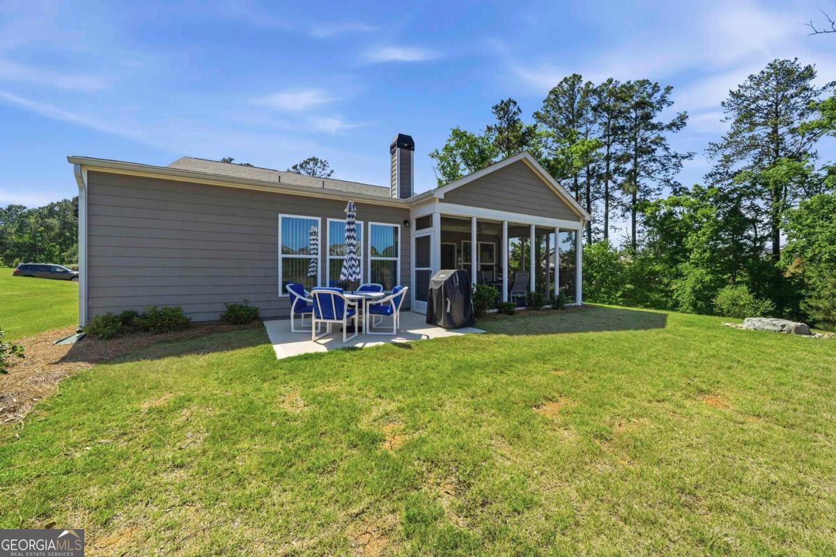 1101 Little Shls Road Greensboro, GA 30642 - Photo 30 of 42 a view of a house with a yard porch and sitting area