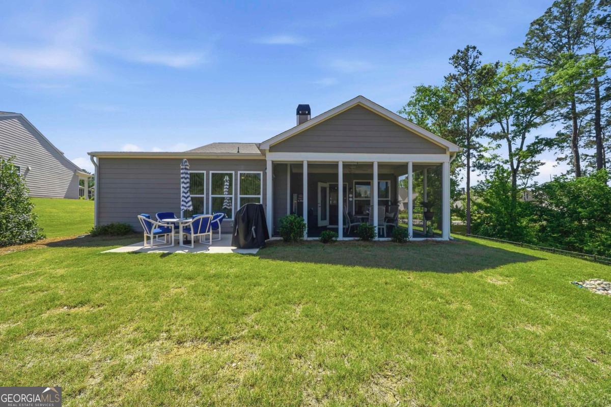 1101 Little Shls Road Greensboro, GA 30642 - Photo 31 of 42 a view of a house with a yard and sitting area