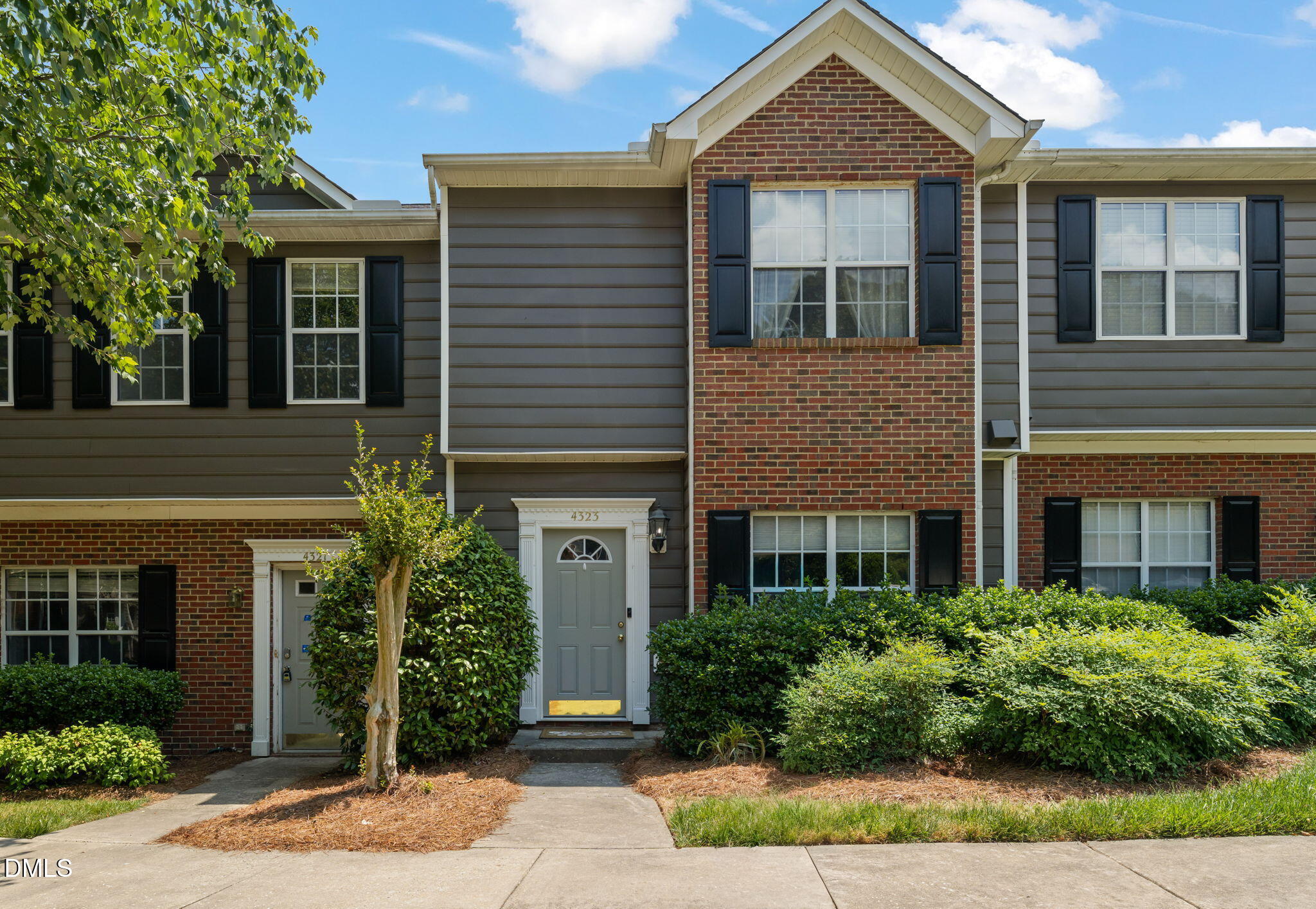 4323 Pine Springs Court Raleigh, NC 27613 - Photo 1 of 38 a front view of a house with garden