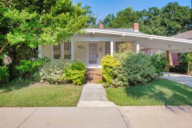 front view of a house with a yard
