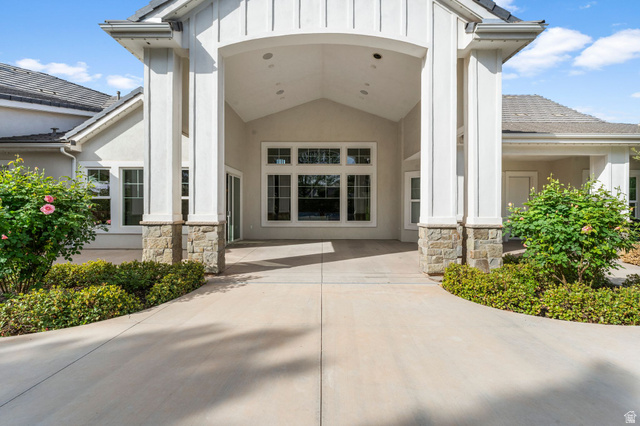2917 Old Farm Road Washington, UT 84780 - Photo 32 of 105 Property entrance with stone siding, stucco siding, and board and batten siding
