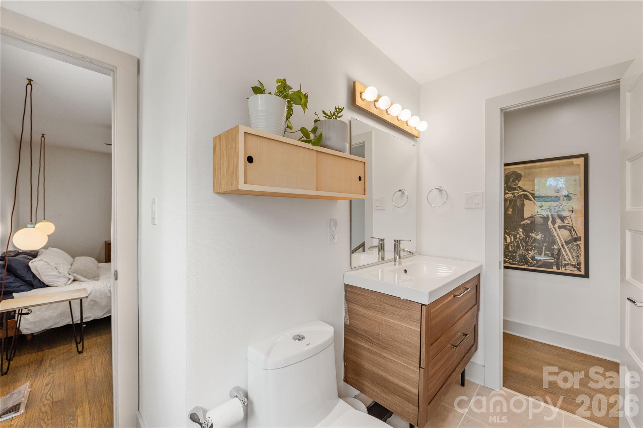 6229 Springfield Drive Charlotte, NC 28212 - Photo 13 of 44 a bathroom with a sink mirror and toilet