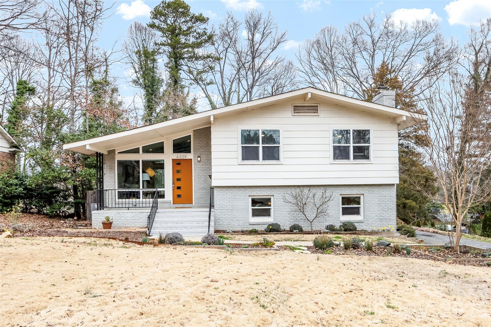 6229 Springfield Drive Charlotte, NC 28212 - Photo 2 of 44 a front view of a house with a yard