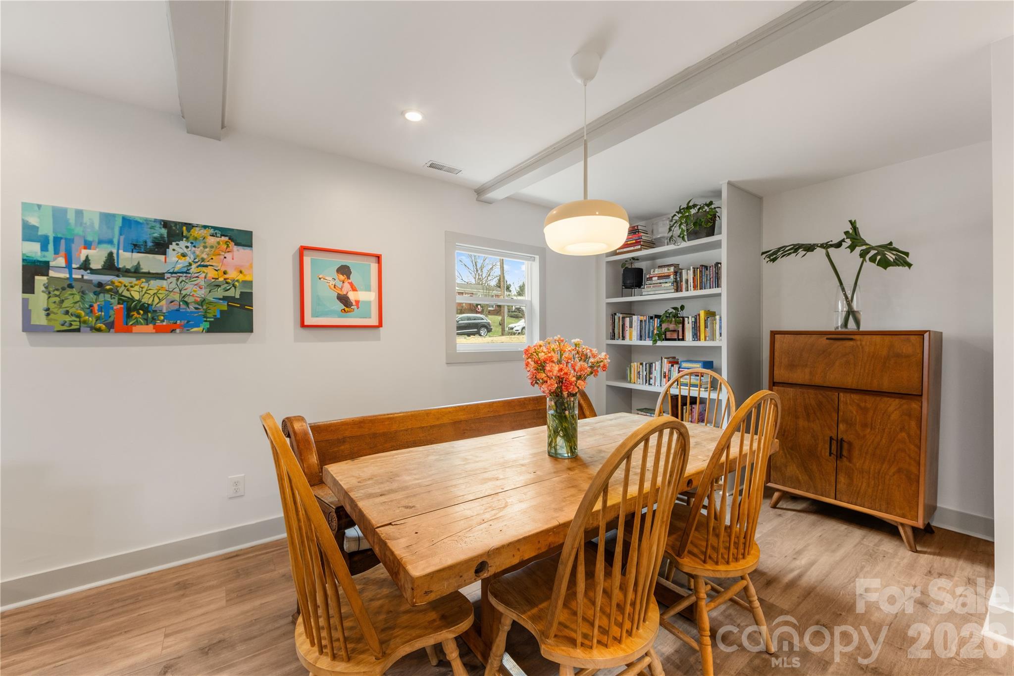 6229 Springfield Drive Charlotte, NC 28212 - Photo 22 of 44 a view of a dining room with furniture and wooden floor