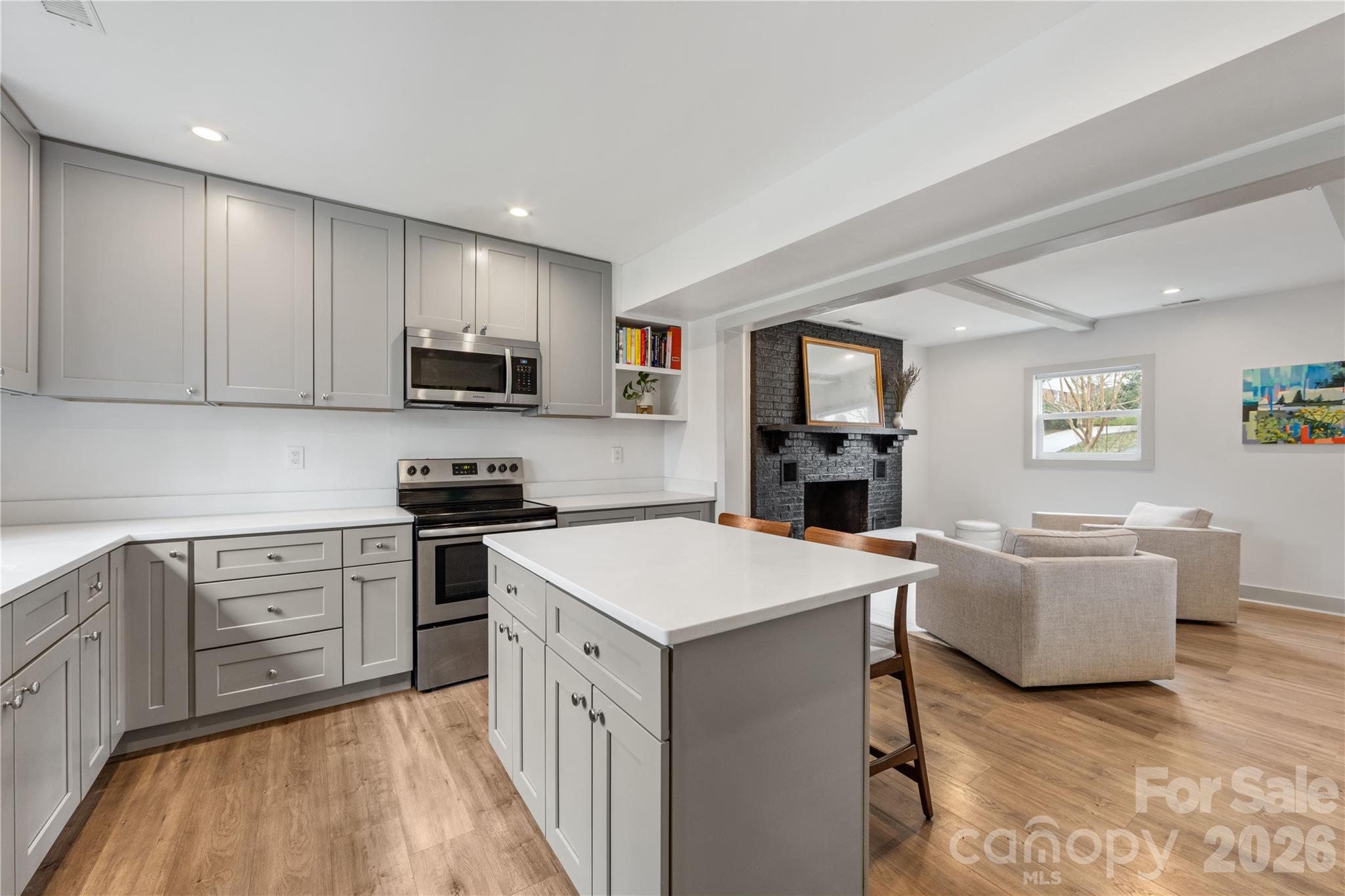 6229 Springfield Drive Charlotte, NC 28212 - Photo 29 of 44 a kitchen with a stove top oven a sink a dining table and chairs
