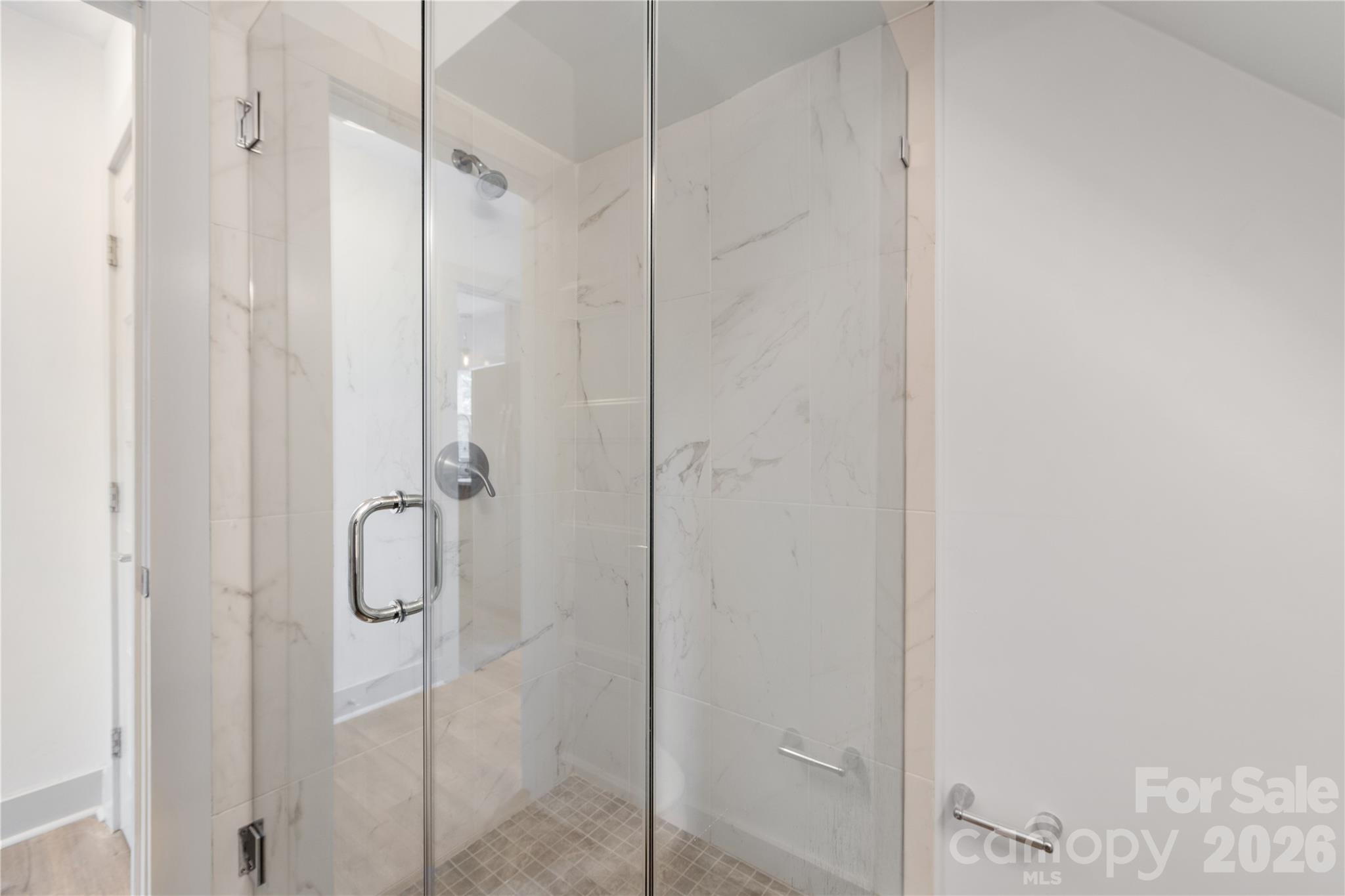 6229 Springfield Drive Charlotte, NC 28212 - Photo 33 of 44 a bathroom with a glass shower door