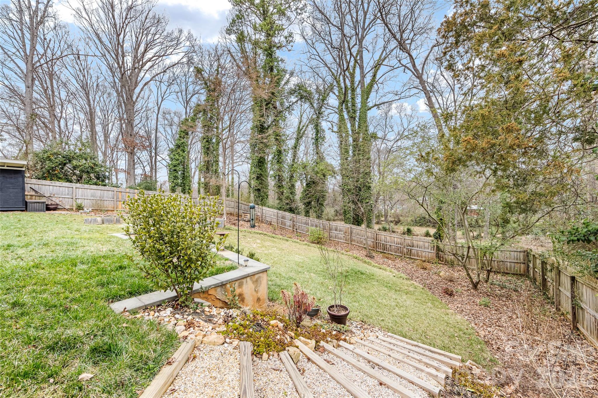 6229 Springfield Drive Charlotte, NC 28212 - Photo 39 of 44 a view of a backyard with large trees