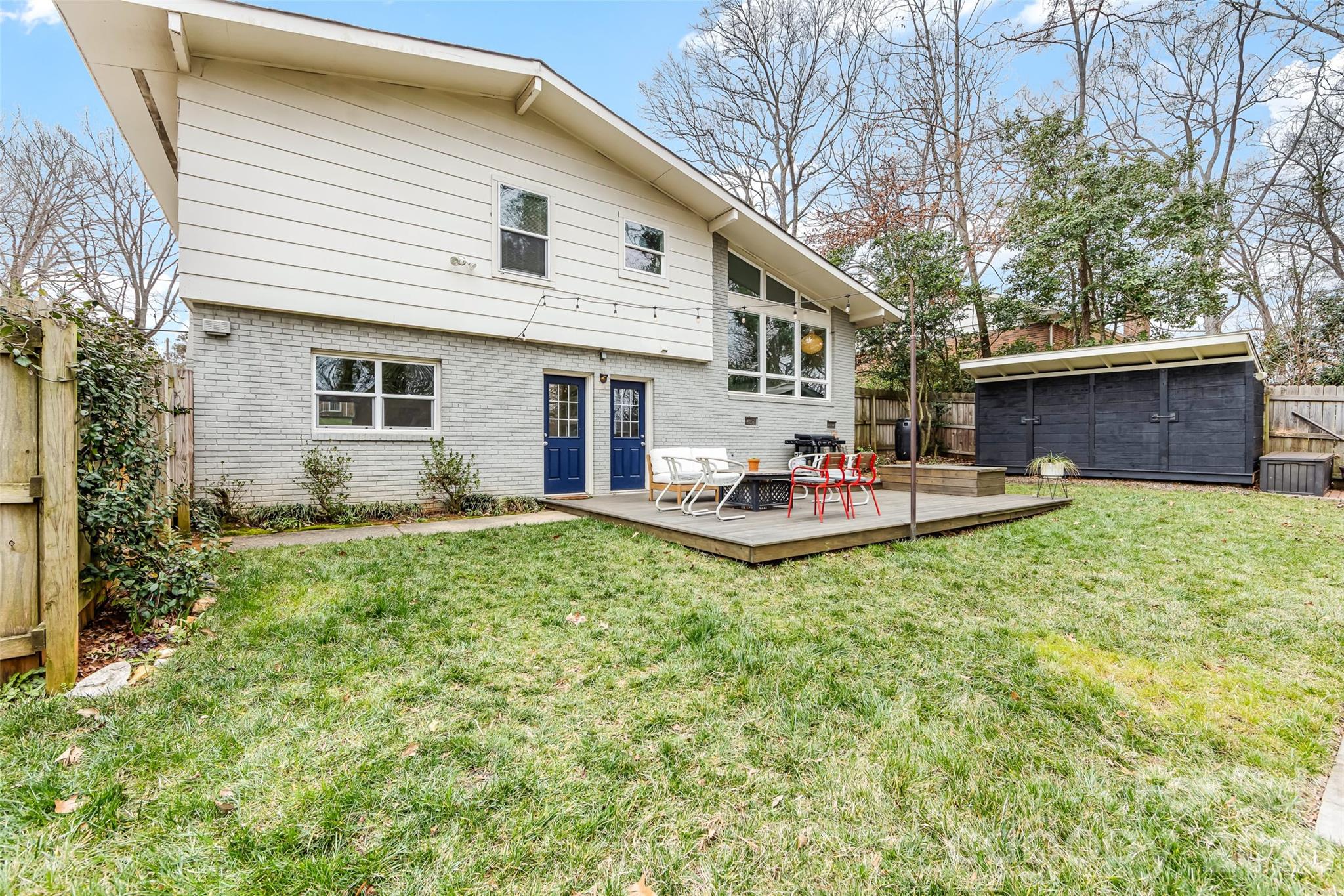 6229 Springfield Drive Charlotte, NC 28212 - Photo 41 of 44 a backyard of a house with table and chairs