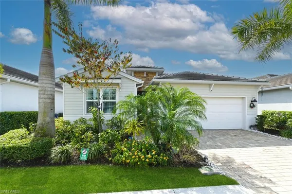 front view of a house with a garden
