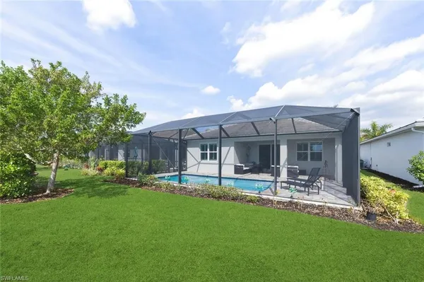 a view of a lake with houses in the back