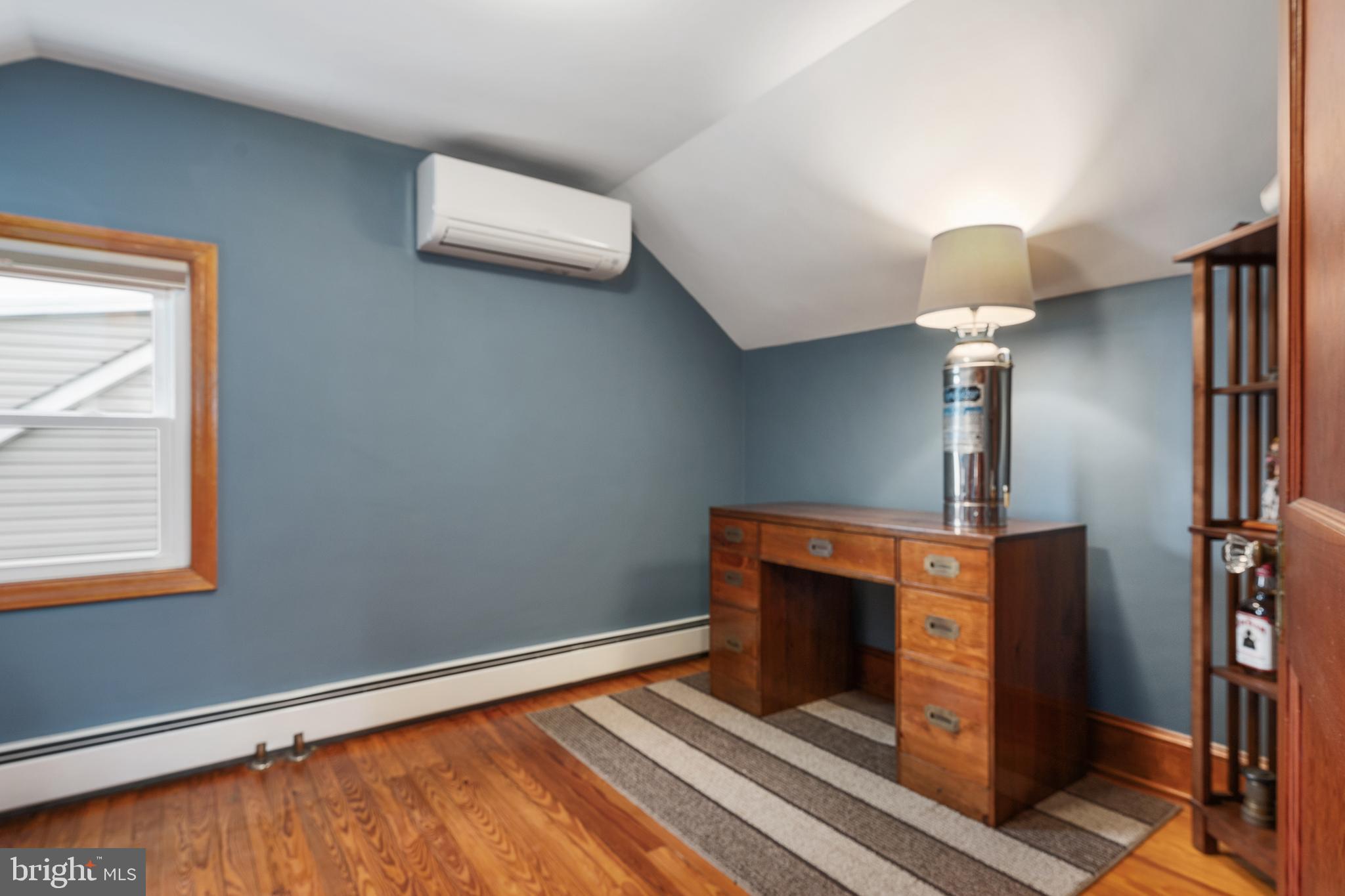 758 North Houcksville Road Hampstead, MD 21074 - Photo 27 of 43 a room with a fireplace and a ceiling fan