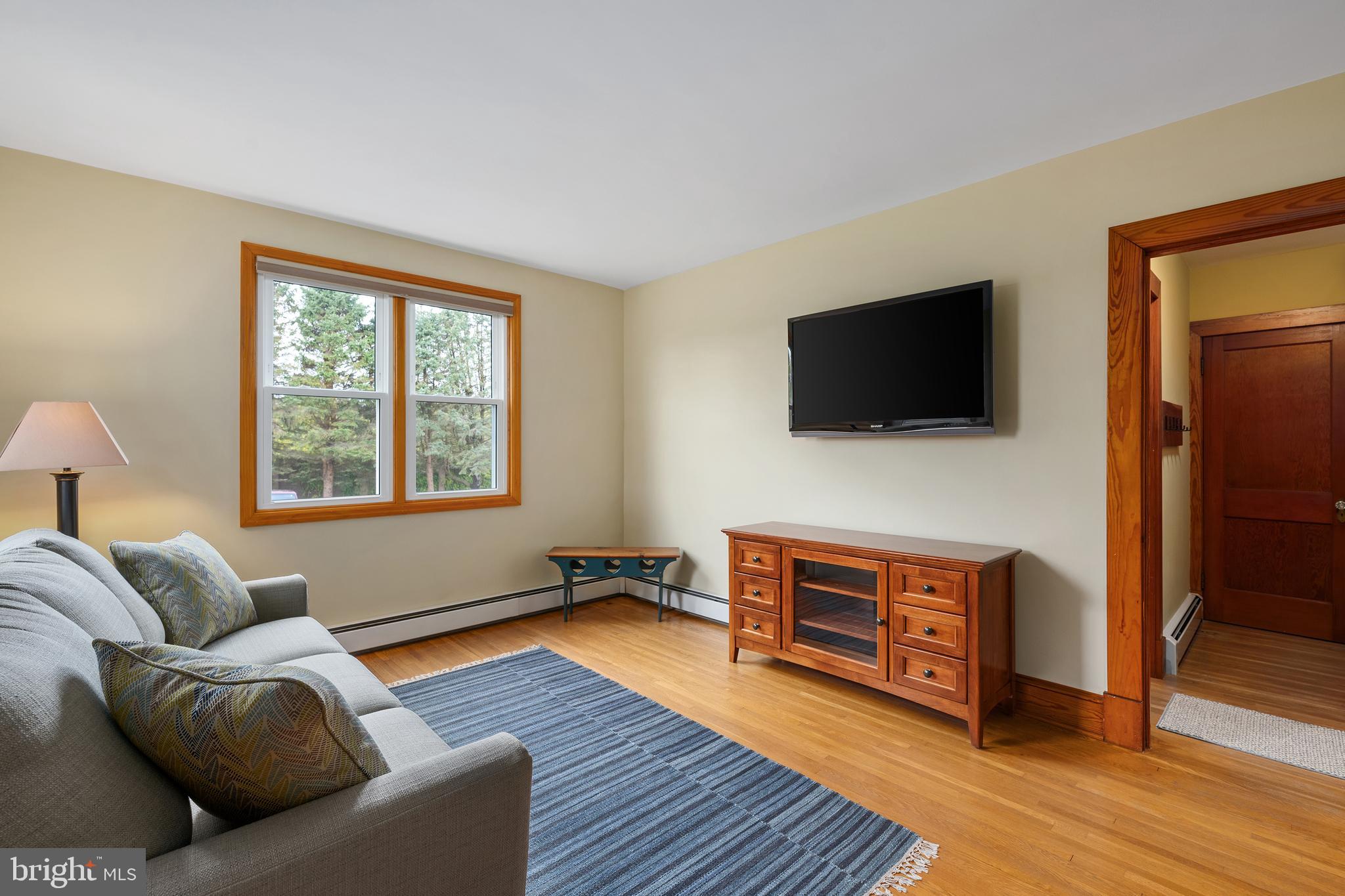 758 North Houcksville Road Hampstead, MD 21074 - Photo 5 of 43 a living room with furniture and a flat screen tv