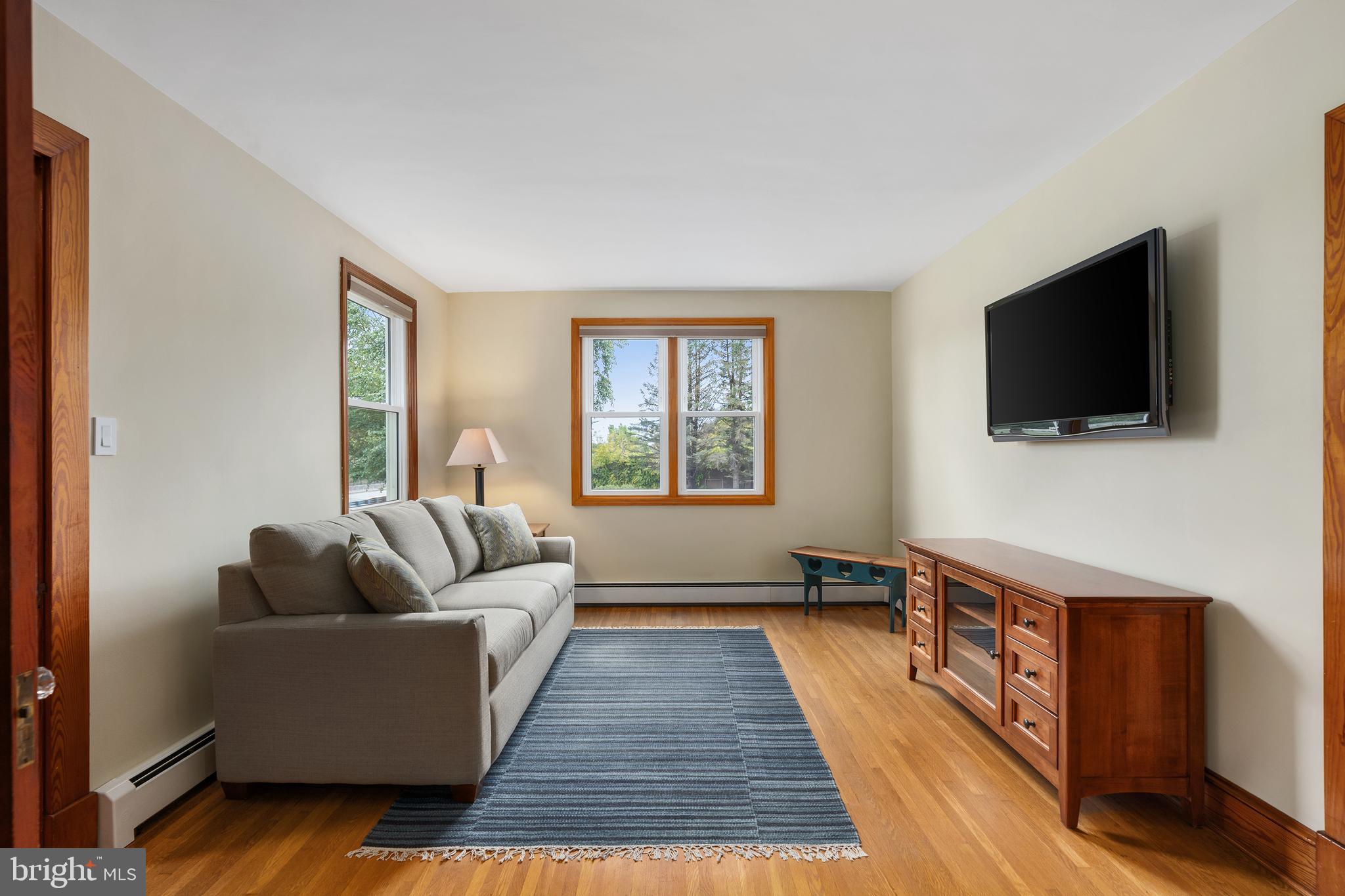 758 North Houcksville Road Hampstead, MD 21074 - Photo 6 of 43 a living room with furniture and a flat screen tv