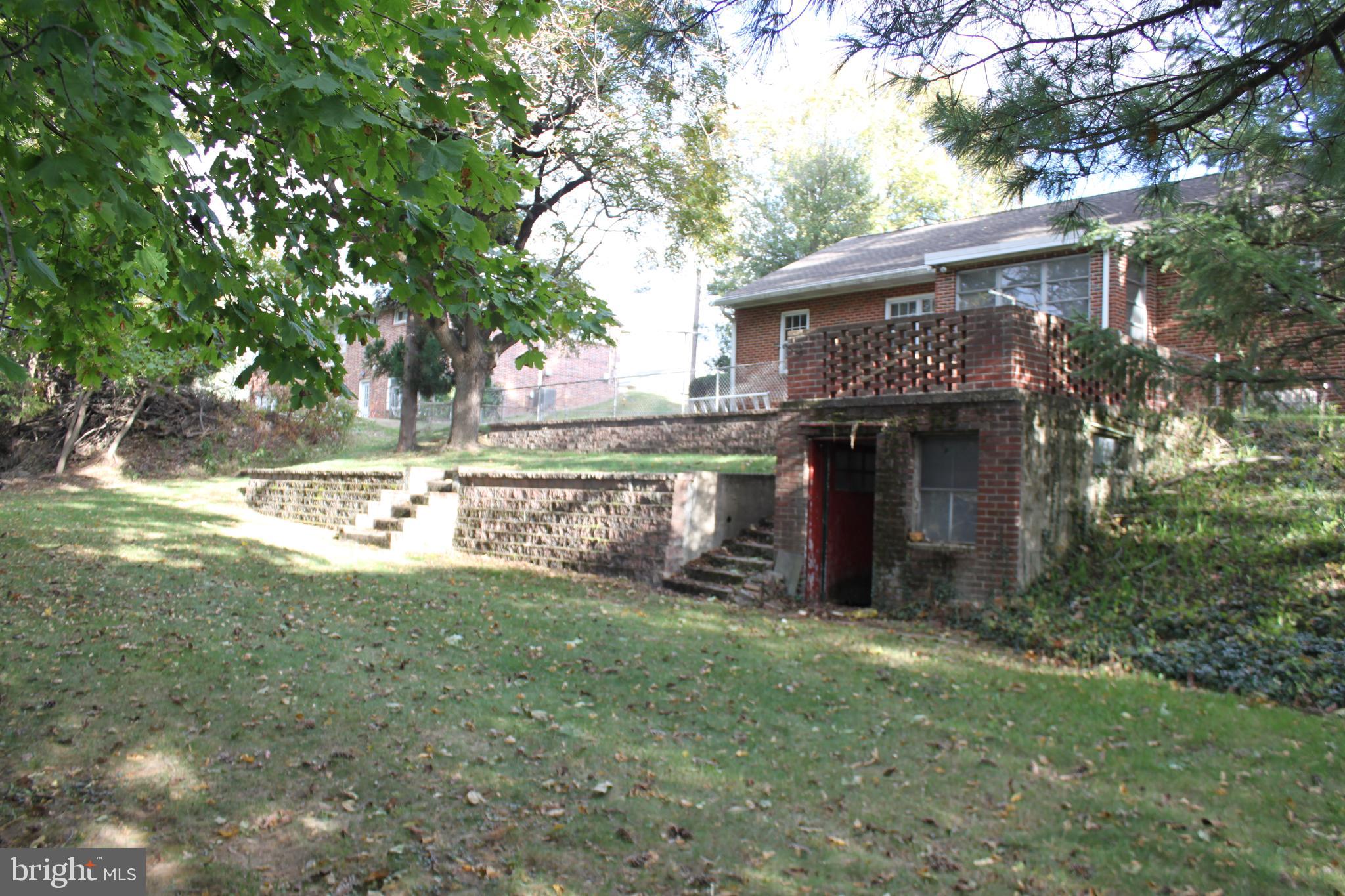 351 Catherine Street Steelton, PA 17113 - Photo 12 of 15 a view of house with yard and a large tree