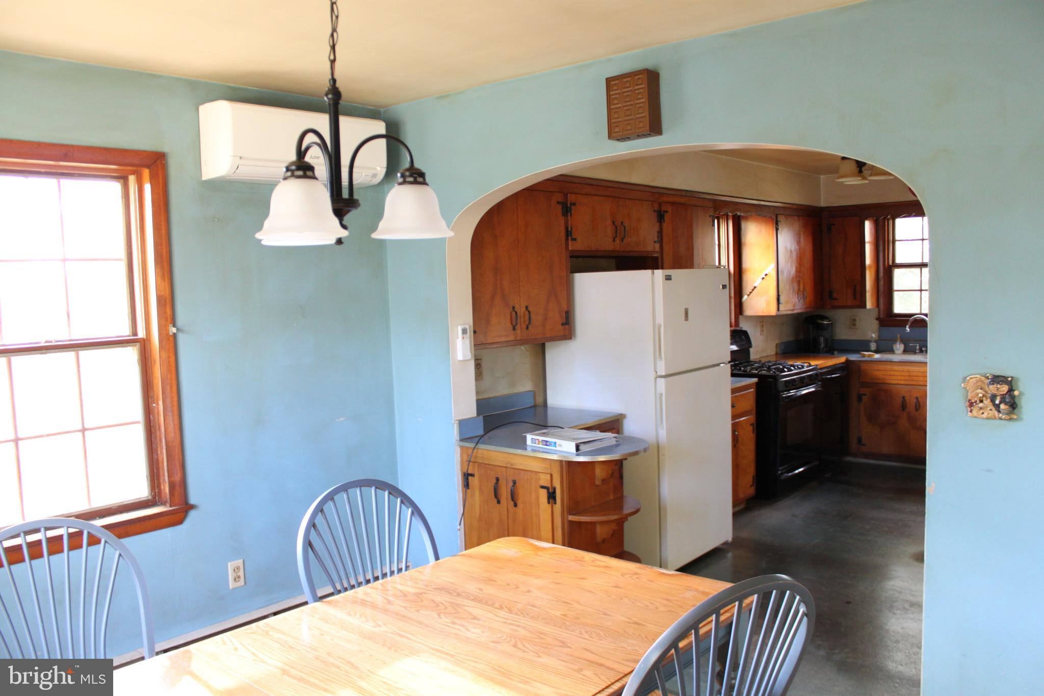 351 Catherine Street Steelton, PA 17113 - Photo 6 of 15 a bedroom with a bed and a chandelier
