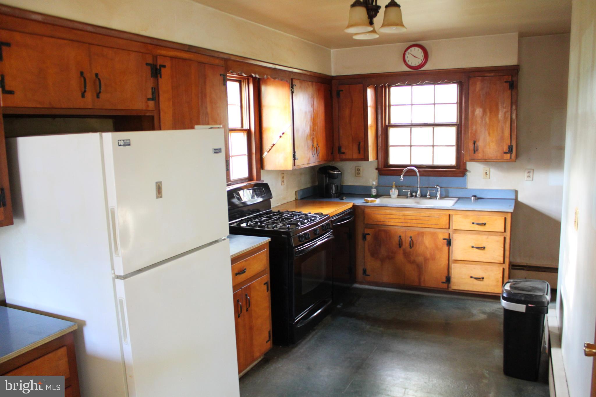 351 Catherine Street Steelton, PA 17113 - Photo 7 of 15 a kitchen with granite countertop a refrigerator stove top oven and sink