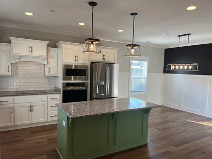 a balcony with furniture and a fireplace