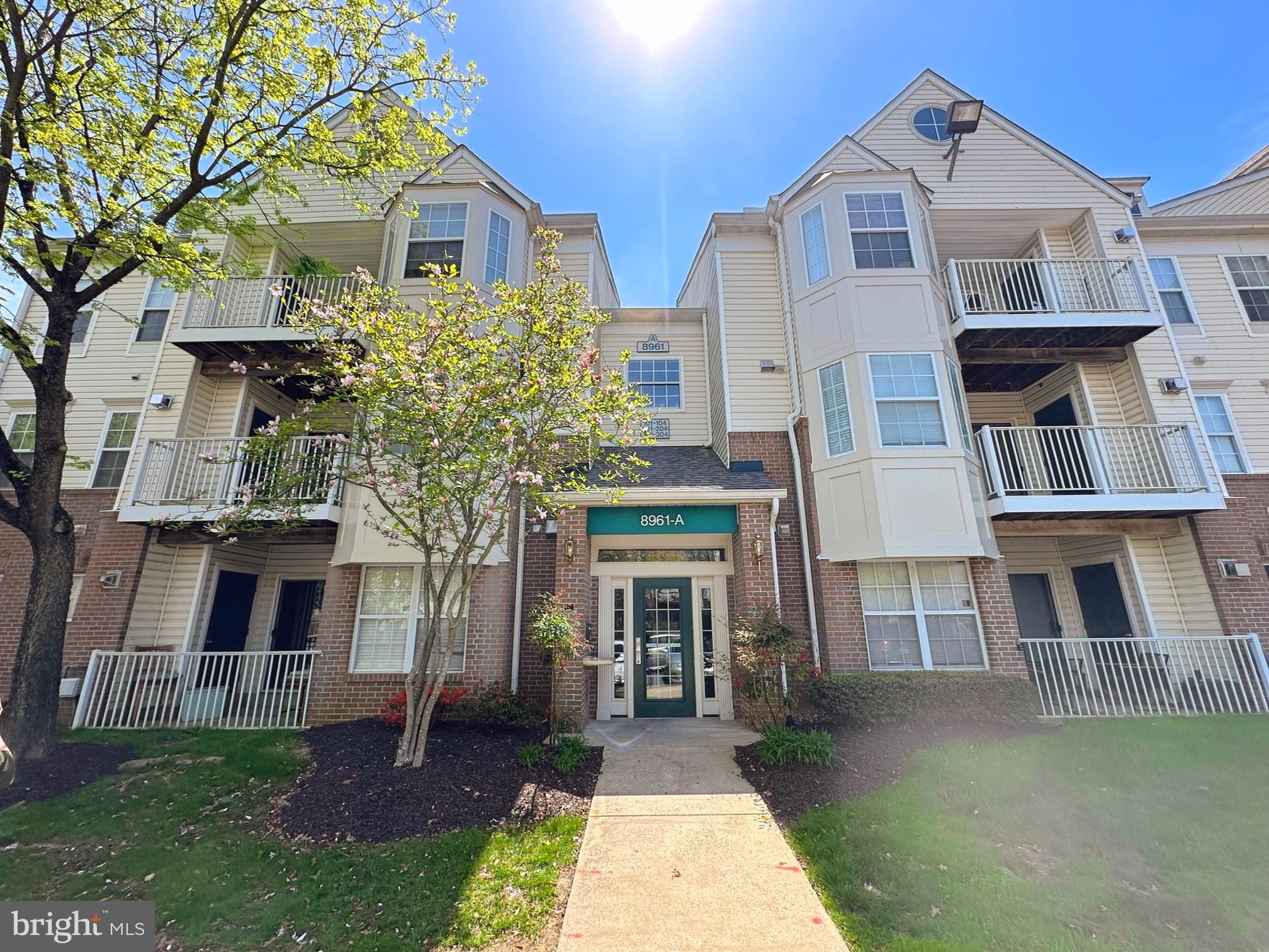 8961 Town Center Circle, Unit 1203 Upper Marlboro, MD 20774 - Photo 1 of 18 a front view of house with yard