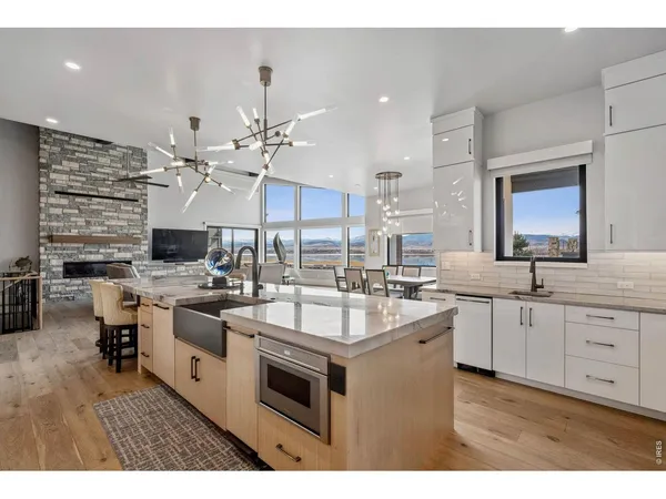 a kitchen with stainless steel appliances granite countertop a sink stove and cabinets