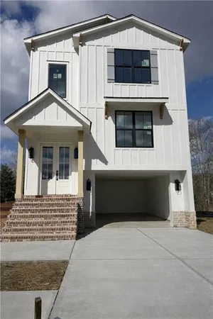 a front view of a house with a garage