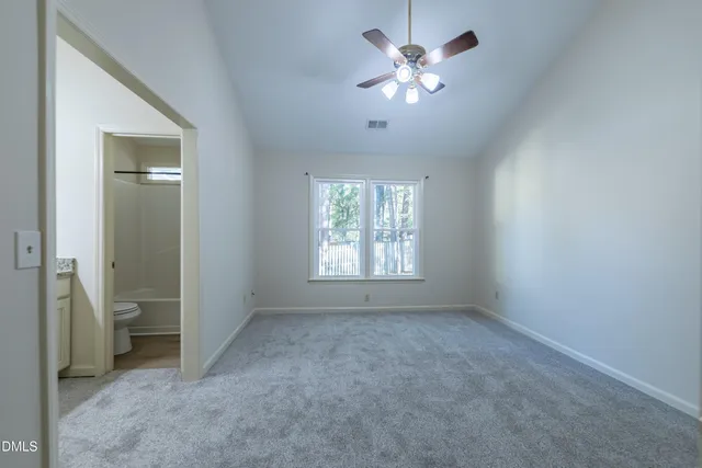 a view of a livingroom with a ceiling fan and a window