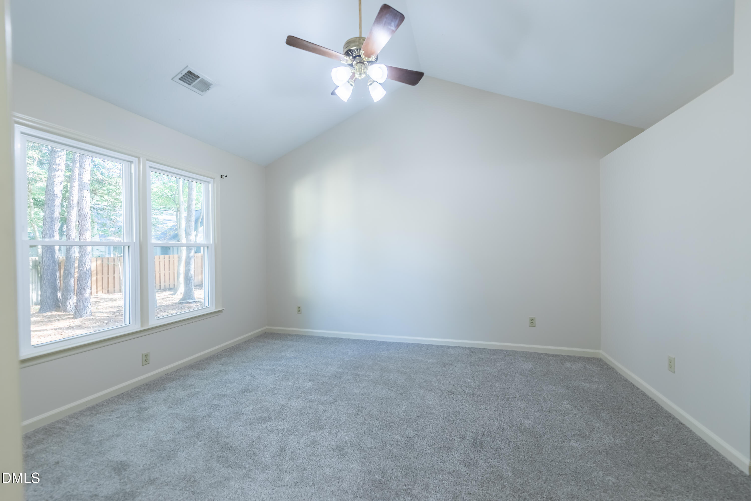 3609 Singleleaf Lane Raleigh, NC 27616 - Photo 16 of 41 an empty room with a window and a fan