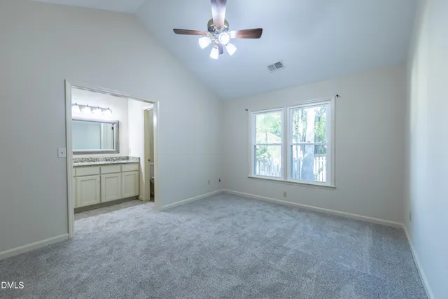 a view of a kitchen with an empty space and a ceiling fan