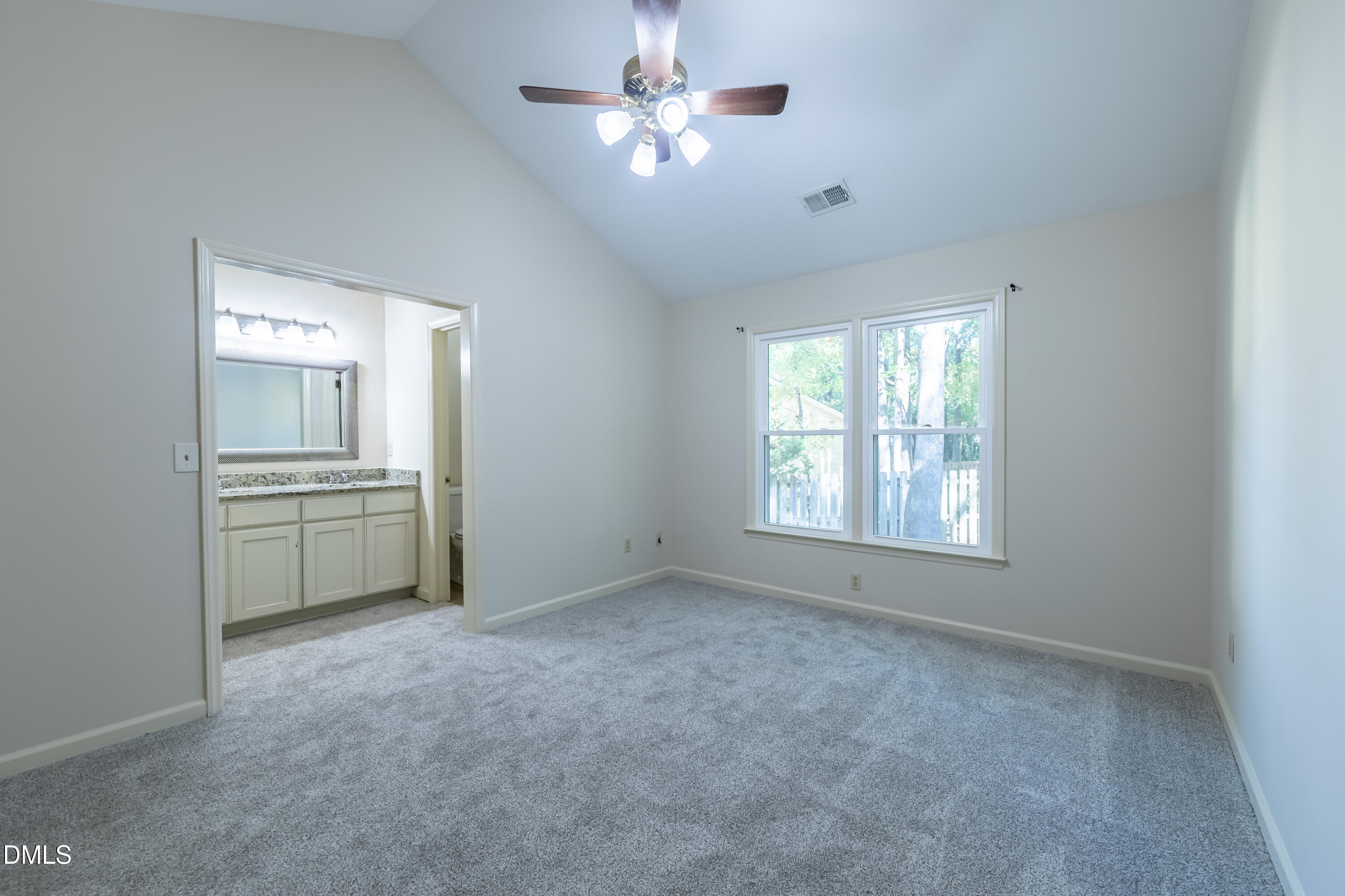 3609 Singleleaf Lane Raleigh, NC 27616 - Photo 17 of 41 a view of a kitchen with an empty space and a ceiling fan