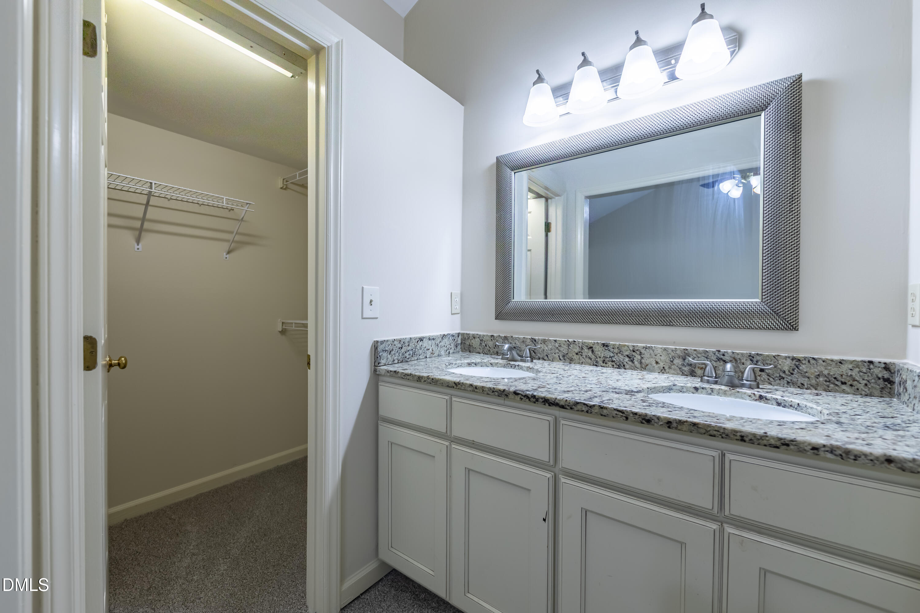 3609 Singleleaf Lane Raleigh, NC 27616 - Photo 19 of 41 a bathroom with a sink and a mirror