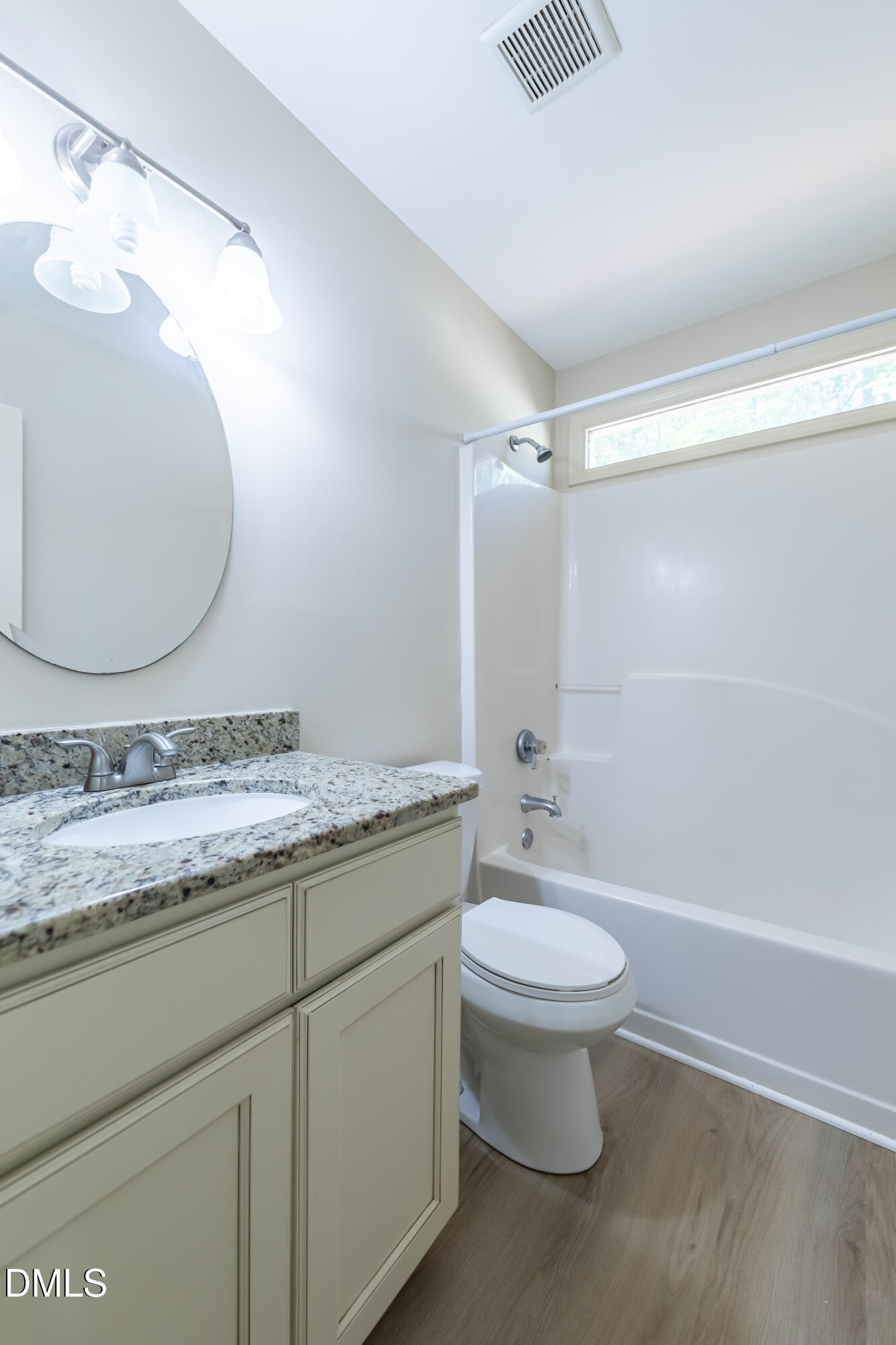 3609 Singleleaf Lane Raleigh, NC 27616 - Photo 22 of 41 a bathroom with a granite countertop sink toilet and a mirror